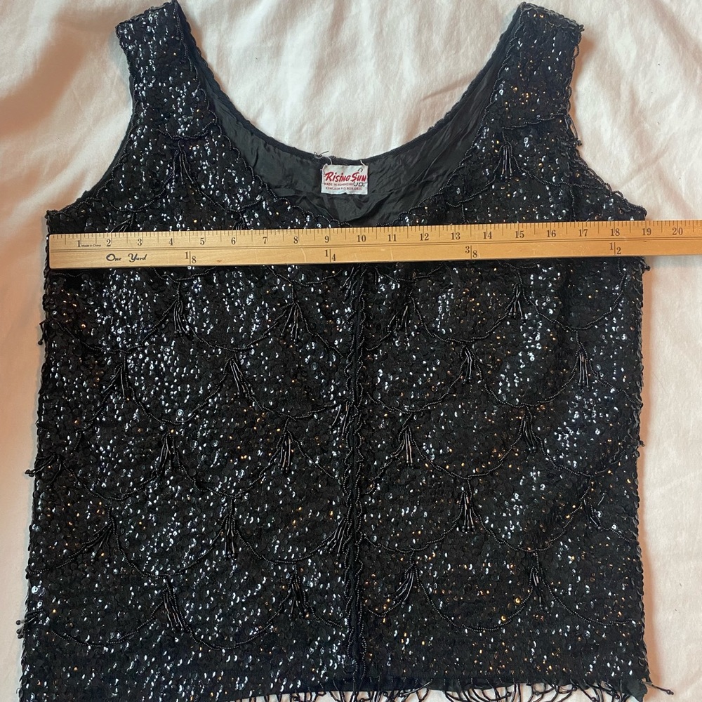 Vintage 1960s black sequin beaded top with beaded fringe. Excellent condition.